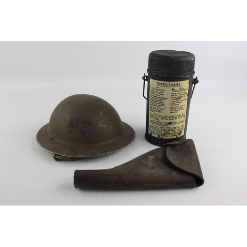 498 - Three pieces of vintage militaria, one WWII era steel helmet, one leather holster and one canteen