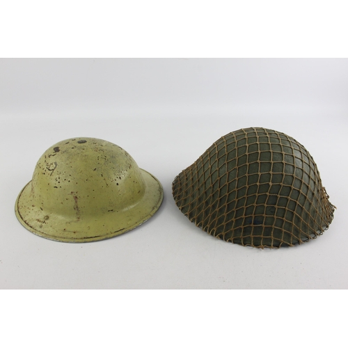 499 - Two vintage military steel helmets