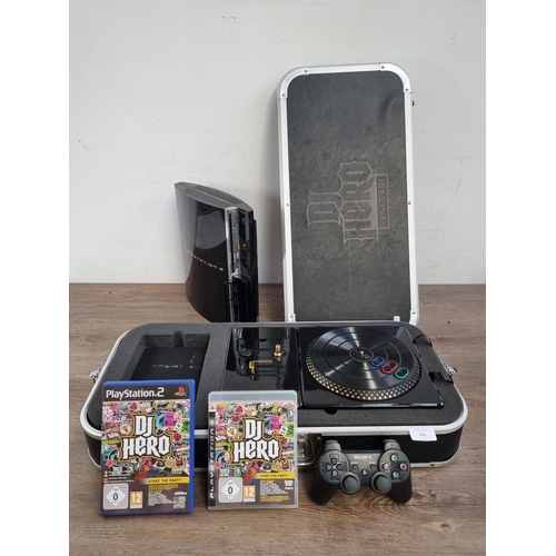 556 - A Sony PlayStation 3 CECHC03 backwards compatible games console with cased DJ HERO RENEGADE PS2/PS3 ... 