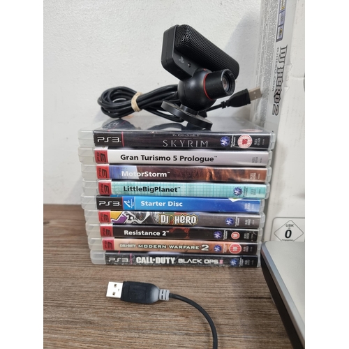 559 - A Sony PlayStation 3 CECHCO3 backwards compatible games console with wireless controller and boxed D... 