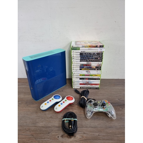 560 - A Microsoft Xbox 360 E limited edition blue 024008743908 games console with controllers and twenty o... 