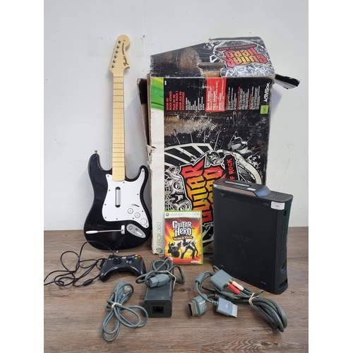 567 - A Microsoft Xbox 360 Elite 250GB games console with boxed Guitar Hero Warriors of Rock and additiona... 