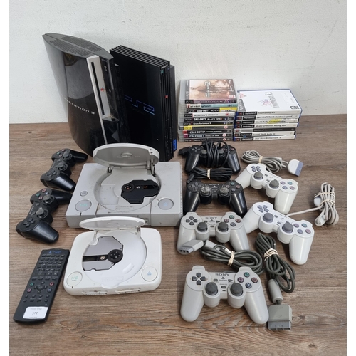 572 - Four Sony PlayStation games consoles, one PlayStation, one PS One, one PS2 and one PS3 together with... 