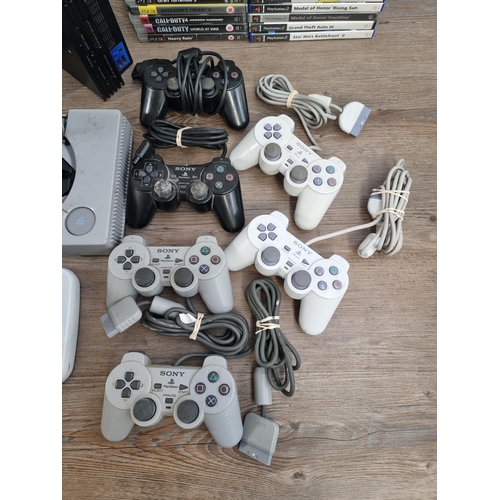 572 - Four Sony PlayStation games consoles, one PlayStation, one PS One, one PS2 and one PS3 together with... 