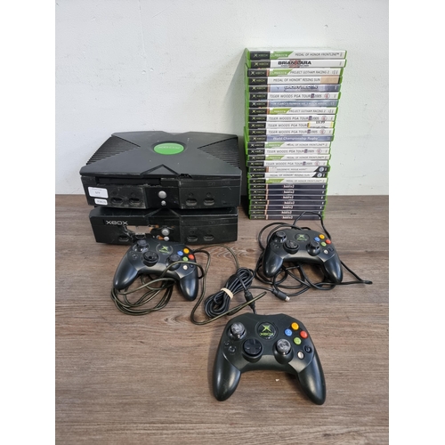 577 - Two Microsoft Xbox Original games consoles with three controllers, one Duke, two S and twenty six ga... 