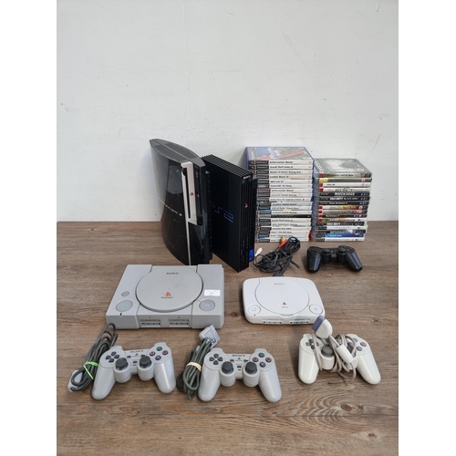 580 - Four Sony PlayStation games consoles, one PS One, one PS2, one PlayStation and one PS3 with accessor... 