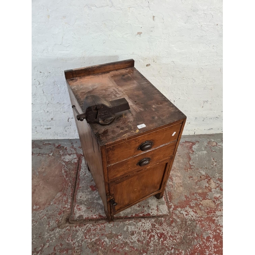 171 - An early/mid 20th century pine tool cabinet containing vintage hand tools and mounted with cast iron... 