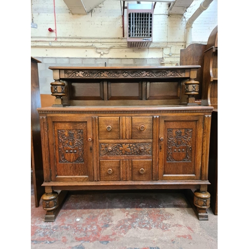 176 - A 17th century style carved oak court cupboard - approx. 129cm high x 136cm wide x 50cm deep