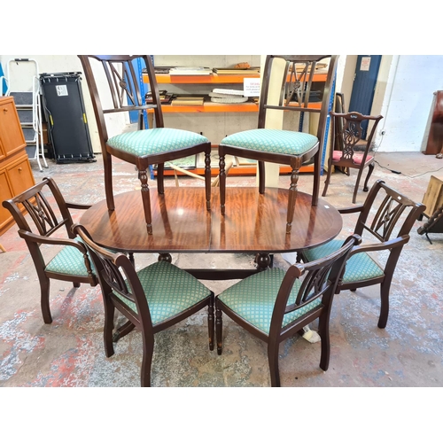 138 - A Regency style mahogany twin pedestal dining table and six matching chairs - approx. 74cm high x 89... 