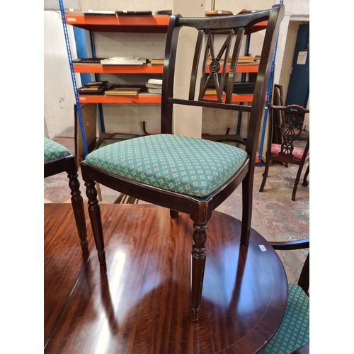 138 - A Regency style mahogany twin pedestal dining table and six matching chairs - approx. 74cm high x 89... 