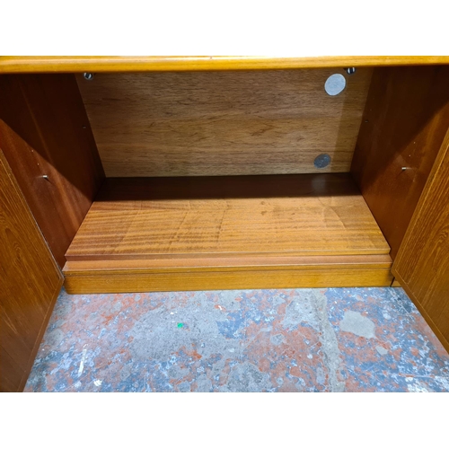 173 - A pair of 1970s G Plan teak two door cabinets with internal shelves - approx. 58cm high x 87cm wide ... 