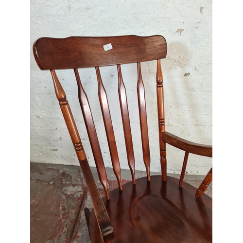 175 - A Victorian style stained beech farmhouse rocking chair - approx. 100cm high x 57cm wide x 46cm deep