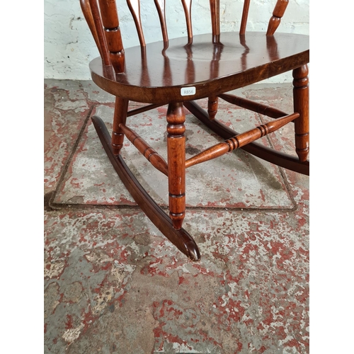 175 - A Victorian style stained beech farmhouse rocking chair - approx. 100cm high x 57cm wide x 46cm deep