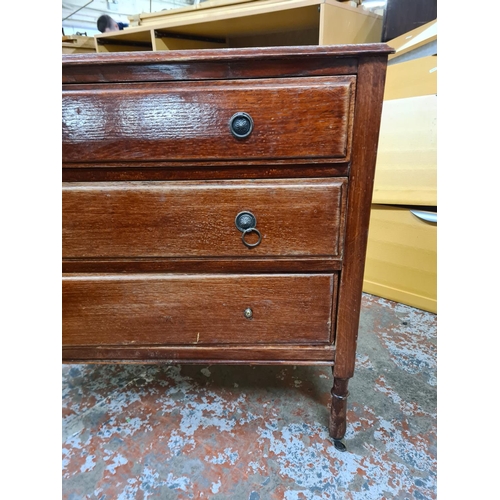 187 - An early 20th century oak chest of three drawers - approx. 82cm high x 91cm wide x 45cm deep