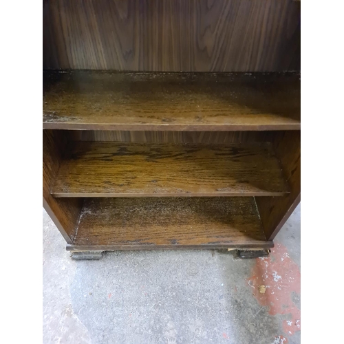 188 - An oak three tier open bookcase - approx. 98cm high x 84cm wide x 30cm deep