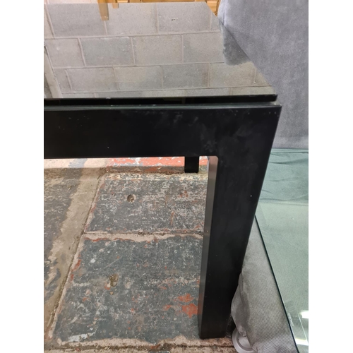 195 - A modern black metal and glass topped rectangular dining table - approx. 78cm high x 90cm wide x 161... 