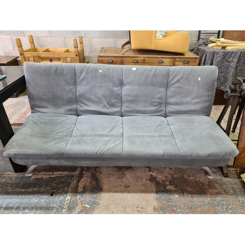 197 - A modern grey fabric upholstered and metal sofa bed