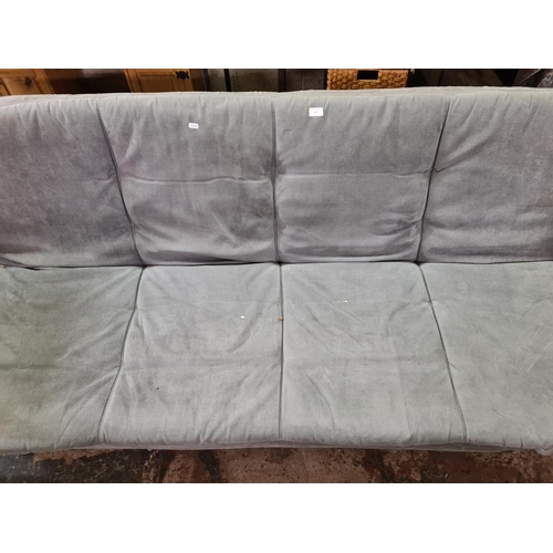 197 - A modern grey fabric upholstered and metal sofa bed