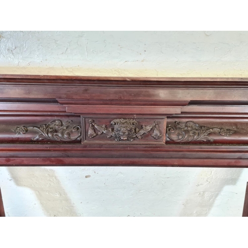 206 - A Victorian carved mahogany fire surround with lion face design - approx. 140cm high x 160cm wide x ... 