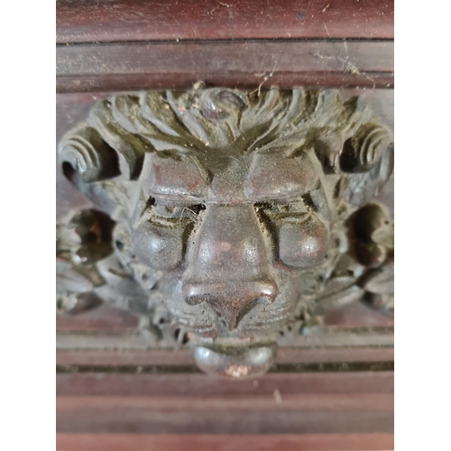 206 - A Victorian carved mahogany fire surround with lion face design - approx. 140cm high x 160cm wide x ... 