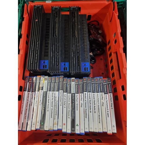 602 - Three Sony PlayStation 2 games consoles with accessories and games