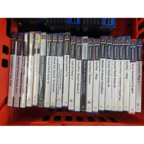 602 - Three Sony PlayStation 2 games consoles with accessories and games