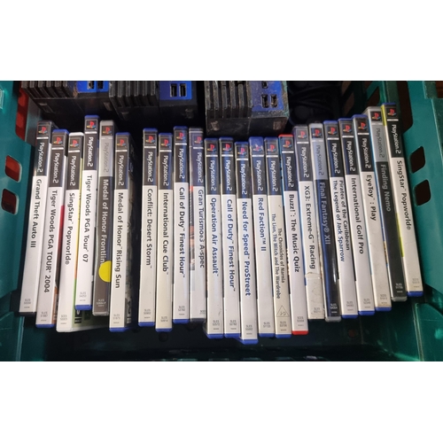 604 - Three Sony PlayStation 2 games consoles with accessories and games