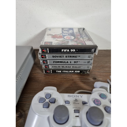 637B - Two Sony PlayStation games consoles with games and accessories