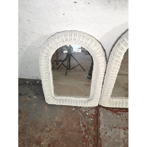 232 - Three white painted wicker framed wall mirrors - approx. 60cm high x 45cm wide