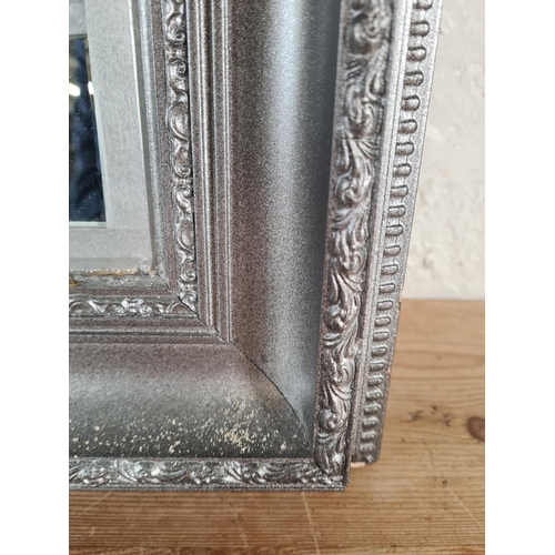 213 - A modern framed wall mirror with Arabesque overlay - approx. 106cm high x 75cm wide