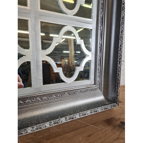 213 - A modern framed wall mirror with Arabesque overlay - approx. 106cm high x 75cm wide