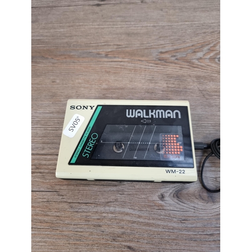 665 - A Sony WM-22 Walkman personal stereo cassette player with headphones