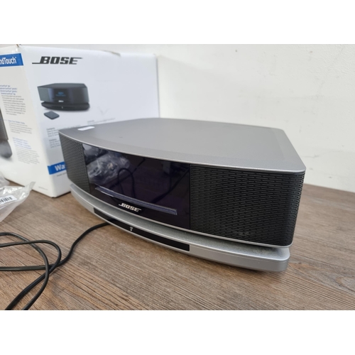 669 - A boxed Bose Wave IV Wi-Fi and Bluetooth all-in-one music system and SoundTouch pedestal with remote... 