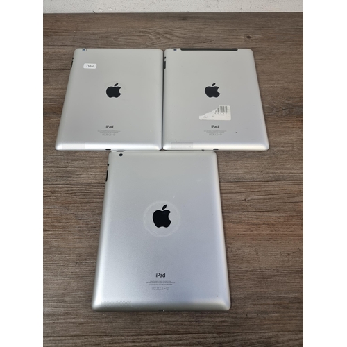 705 - Three Apple iPad tablets, two A1458 and one A1459