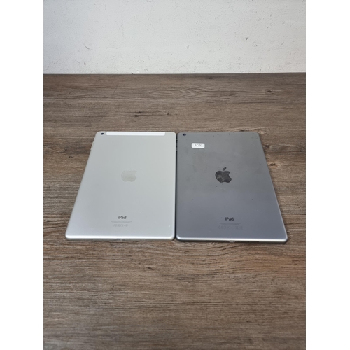 706 - Two Apple iPad Air tablets, one A1474 and one A1475