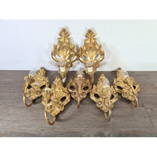 485 - Seven Rococo style gilded wall sconces