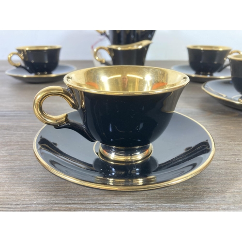 340 - A 1950s Stavangerflint Norway black and gold twelve piece coffee set