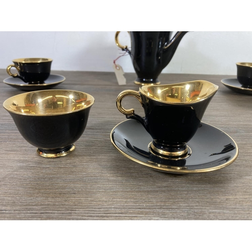 340 - A 1950s Stavangerflint Norway black and gold twelve piece coffee set