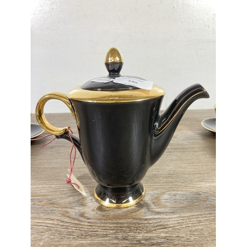 340 - A 1950s Stavangerflint Norway black and gold twelve piece coffee set