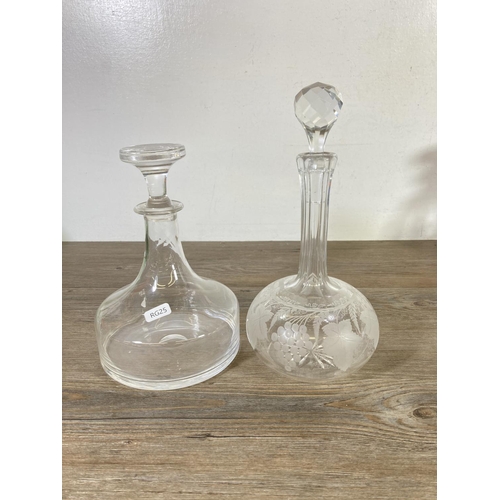 345 - A collection of glassware to include three decanters, green glass hand blown decanter etc.