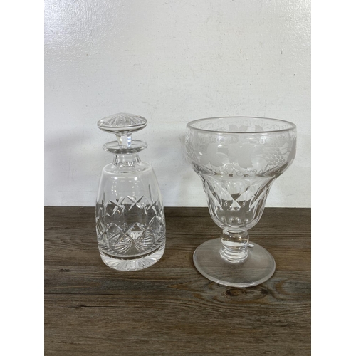 345 - A collection of glassware to include three decanters, green glass hand blown decanter etc.