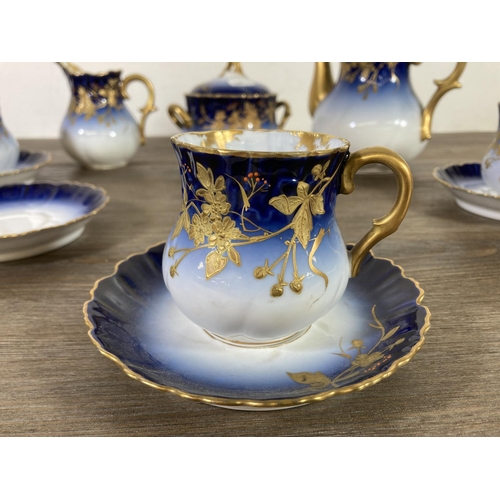 348 - A D & C France Limoges blue and gold porcelain ten piece coffee set