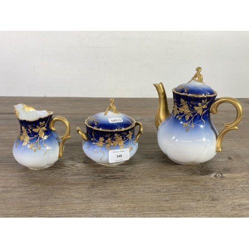 348 - A D & C France Limoges blue and gold porcelain ten piece coffee set