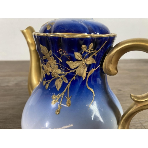 348 - A D & C France Limoges blue and gold porcelain ten piece coffee set