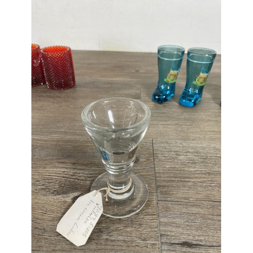 354C - A collection of clear and coloured glassware to include a Victorian penny lick ice cream glass etc.