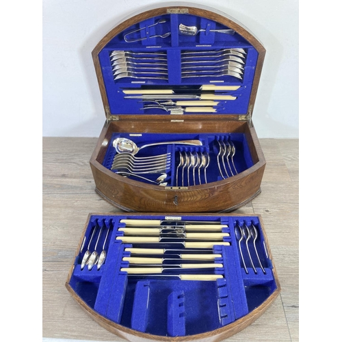 355 - A 1920s Walker & Hall oak presentation canteen of cutlery - presented by the directors and staff of ... 