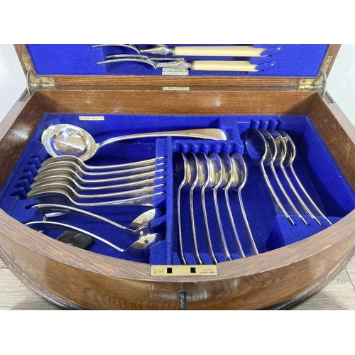 355 - A 1920s Walker & Hall oak presentation canteen of cutlery - presented by the directors and staff of ... 