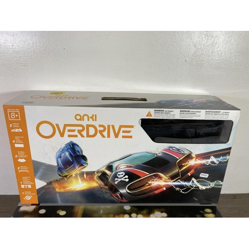 389 - Two boxed slot car sets, one Next Mini Cooper racing track and one Anki Overdrive