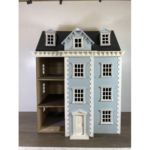 393 - A Georgian style three storey doll’s house with furniture and accessories - approx. 86cm high x 73cm... 