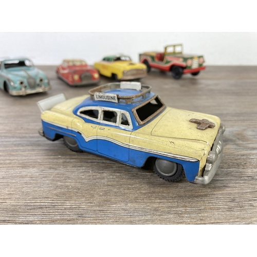 409 - Five mid 20th century tinplate model vehicles